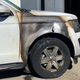 A photo of a burned fender and wheel on a Ford Expedition SUV.